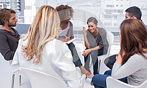 Woman getting depressed in group therapy