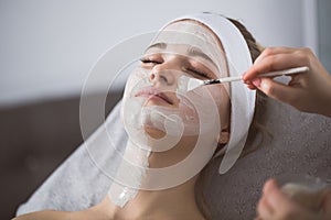 Woman getting enzymatic peeling at beautician`s photo