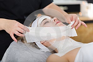 Woman getting enzymatic peeling at beautician`s