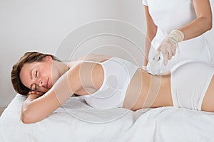 Woman Getting Epilation Laser Treatment photo