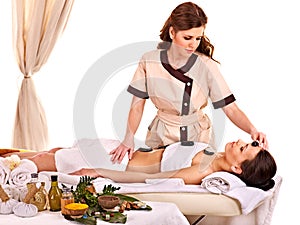 Woman getting facial mask in spa .