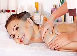 Woman getting facial massage .