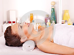 Woman getting facial massage .