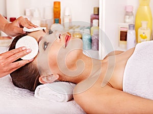 Woman getting facial massage .