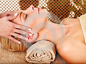 Woman getting facial massage .