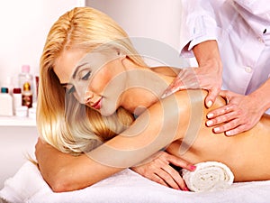 Woman getting facial massage .