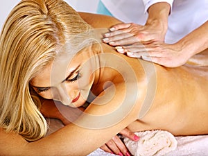 Woman getting facial massage .