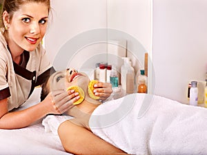 Woman getting facial massage .
