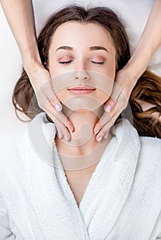 Woman getting facial massage