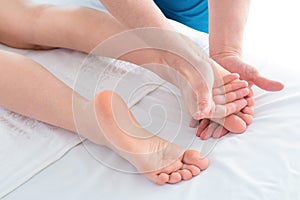 Woman getting a foot massage at a health spa