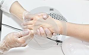 woman getting hand massage in beauty salon