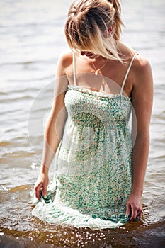 Woman getting her dress wet