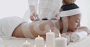 Woman Getting Hot Stone Massage