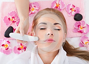 Woman getting microdermabrasion treatment