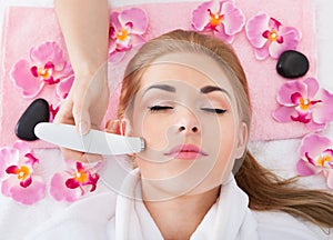 Woman getting microdermabrasion treatment photo