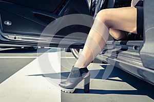 Woman getting out the car. photo