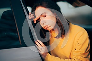 Woman Getting out of the Car Suffering from Motion Sickness