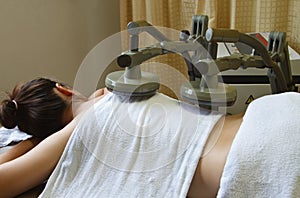 Woman getting physical therapy,treatment muscle wi