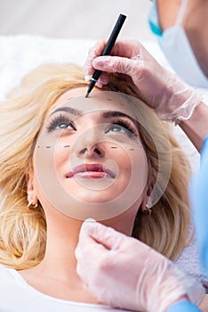 The woman getting ready for plastic surgery