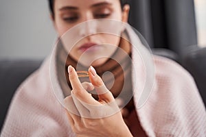 Woman getting ready to taking a pill