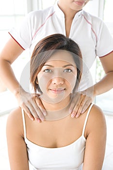 Woman getting a shoulder massage
