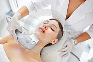 Woman getting SMAS lifting procedure in beauty clinic