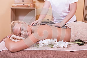 Woman Getting Stones Massage