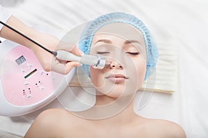 woman getting ultrasound nose cleaning at beauty salon