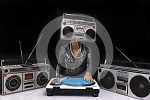 Woman with ghettoblaster as a head Djing