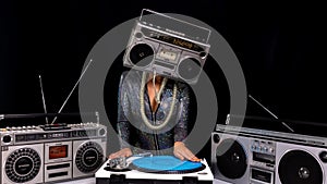 Woman with ghettoblaster as a head Djing