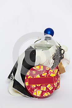 A woman gift box containing a handkerchief, perfume and a broach