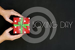 Woman with a gift and text boxing day
