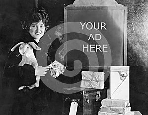 Woman with gifts and sign with number of shopping days until Christmas