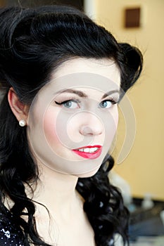 Woman girl pin-up make-up retro hairstyle indoor