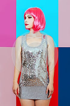 Woman girl pink hair silver dress background multicolored graphic red blue portrait beauty tenderness disco deadpen emotions