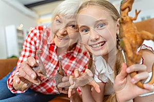 Woman and a girl with plastic toys