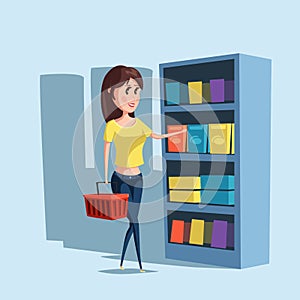 Woman or girl shopping at supermarket with basket