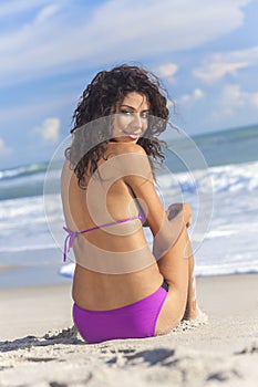 Woman Girl Sitting in Bikini on Beach