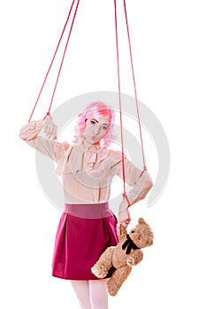 Woman girl stylized like marionette puppet on string