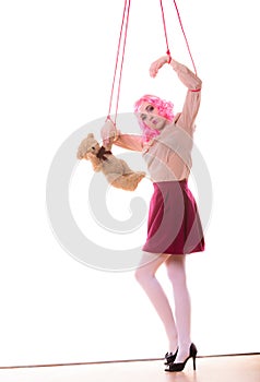 Woman girl stylized like marionette puppet on string