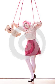 Woman girl stylized like marionette puppet on string