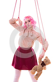 Woman girl stylized like marionette puppet on string