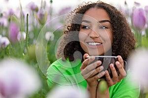 Woman Girl Teenager Field of Flowers Drinking Cup of Coffee or Tea