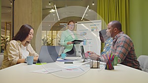 Woman giving business presentation to colleague