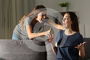 Woman giving a fright to a friend photo
