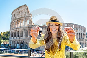 Woman giving headphones with audio guide in rome