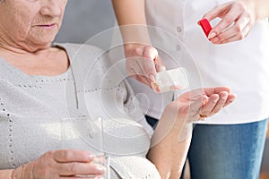 Woman giving medicine