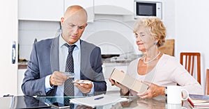 Woman giving money to agent