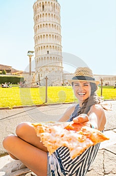 Woman giving pizza in pisa, tuscany, italy