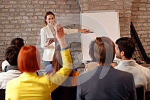 Woman giving presentation on the chart on the seminar